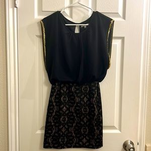 Black sleeveless dress with lace skirt